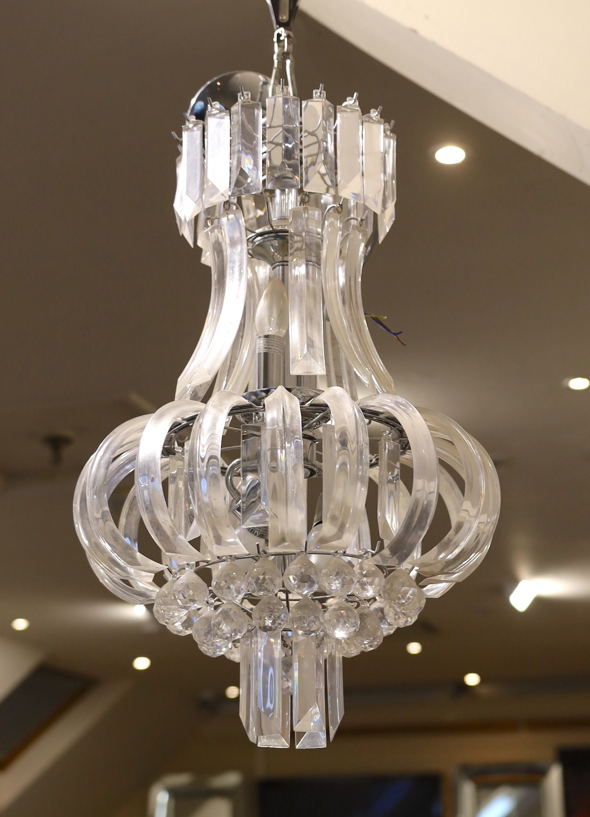 A pair of contemporary perspex chandeliers